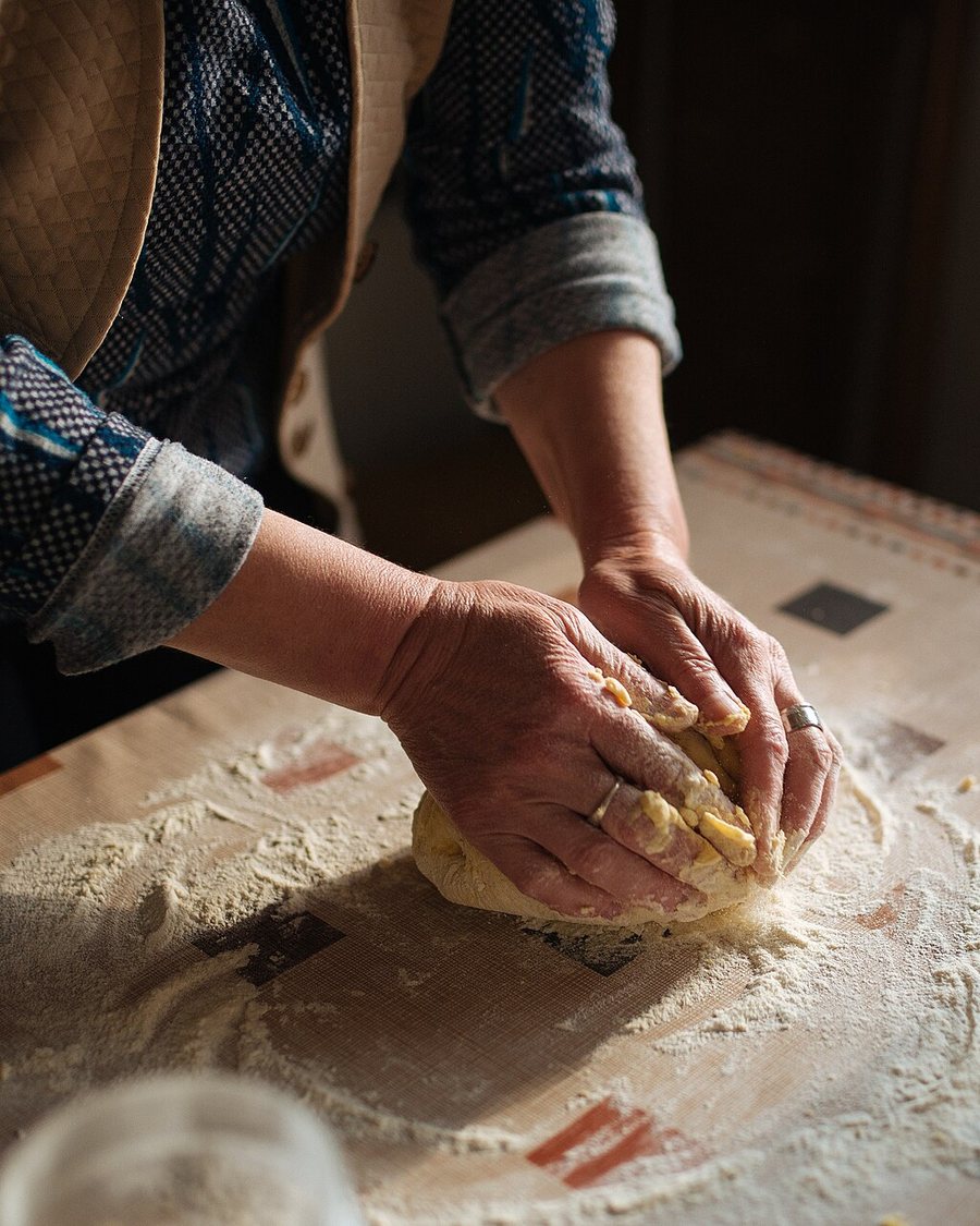 Hands working a soft dough